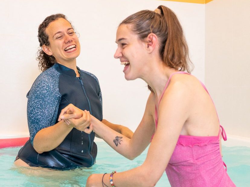 enjoying water therapy for improved movement. Concept of cerebral palsy, hydrotherapy